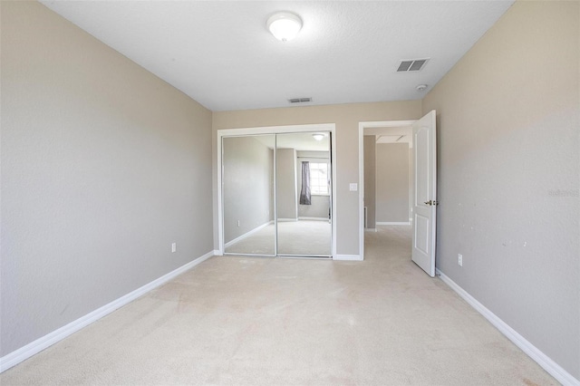 201 Dyson Dr, Deland, FL 32724 - unfurnished bedroom with light colored carpet, a closet, and baseboards
