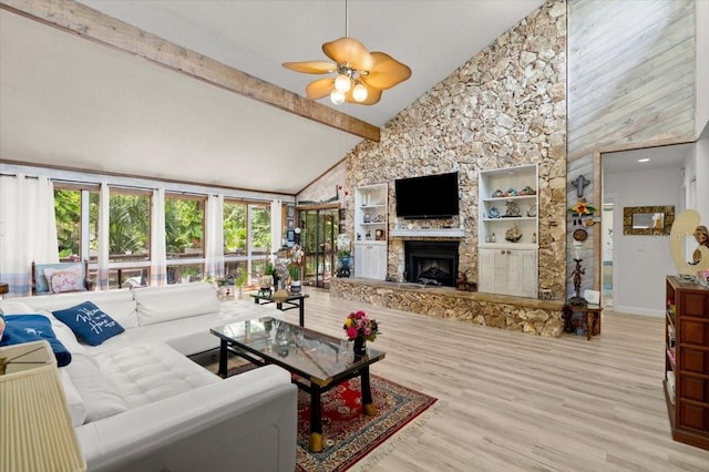 96 Hollow Branch Xing, Ormond Beach, FL 32174 - living area with a stone fireplace, high vaulted ceiling, beam ceiling, wood finished floors, and a ceiling fan