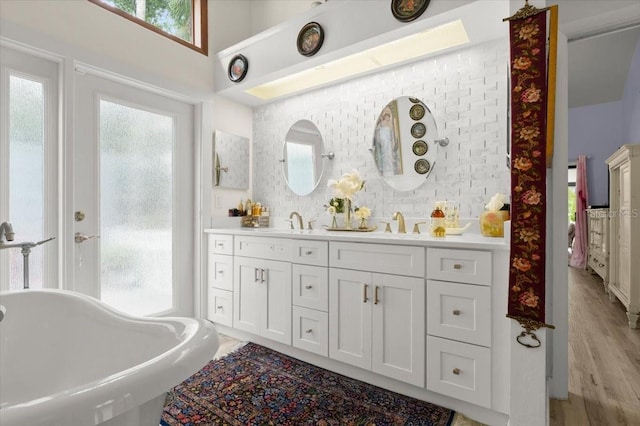 96 Hollow Branch Xing, Ormond Beach, FL 32174 - full bath with a freestanding bath, double vanity, and wood finished floors