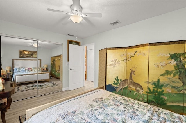 96 Hollow Branch Xing, Ormond Beach, FL 32174 - bedroom featuring wood finished floors, a closet, and a ceiling fan