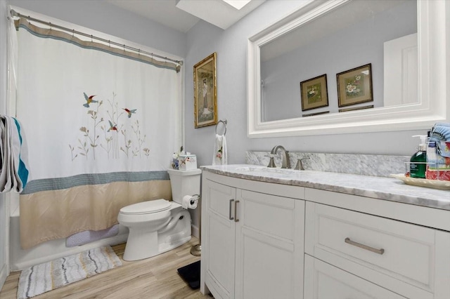 96 Hollow Branch Xing, Ormond Beach, FL 32174 - full bath with toilet, wood finished floors, vanity, and a skylight