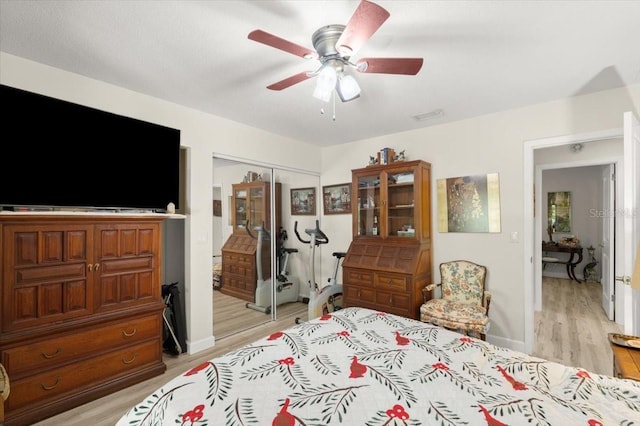 96 Hollow Branch Xing, Ormond Beach, FL 32174 - bedroom with light wood-type flooring, a closet, and a ceiling fan