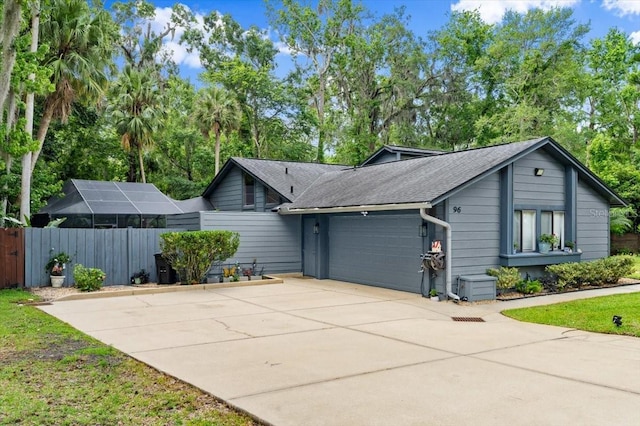 96 Hollow Branch Xing, Ormond Beach, FL 32174 - ranch-style home with a garage, driveway, and roof with shingles