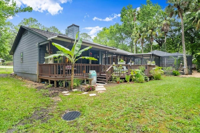 96 Hollow Branch Xing, Ormond Beach, FL 32174 - back of house with a chimney, a wooden deck, and a yard