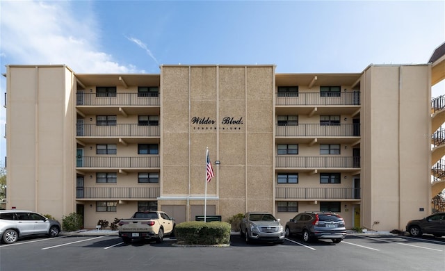 325 Wilder Blvd Unit A102, Daytona Beach, FL 32114 - view of apartment building / complex featuring uncovered parking