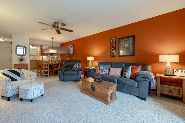 325 Wilder Blvd Unit A102, Daytona Beach, FL 32114 - living area featuring a ceiling fan and light carpet