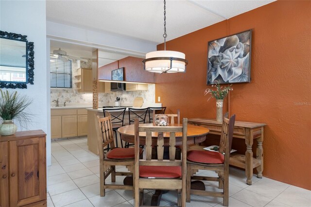 325 Wilder Blvd Unit A102, Daytona Beach, FL 32114 - dining room with light tile patterned floors and a textured wall