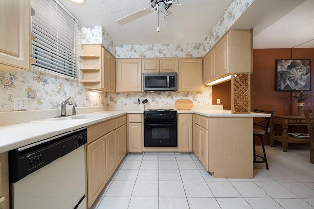 325 Wilder Blvd Unit A102, Daytona Beach, FL 32114 - kitchen with stainless steel microwave, white dishwasher, and light brown cabinets