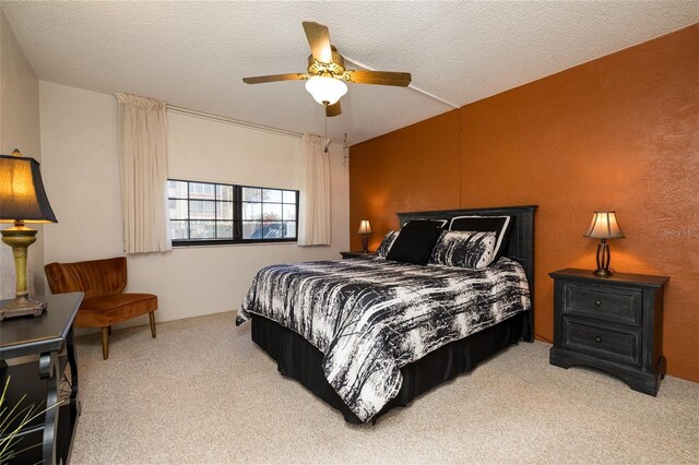 325 Wilder Blvd Unit A102, Daytona Beach, FL 32114 - carpeted bedroom with ceiling fan and a textured ceiling