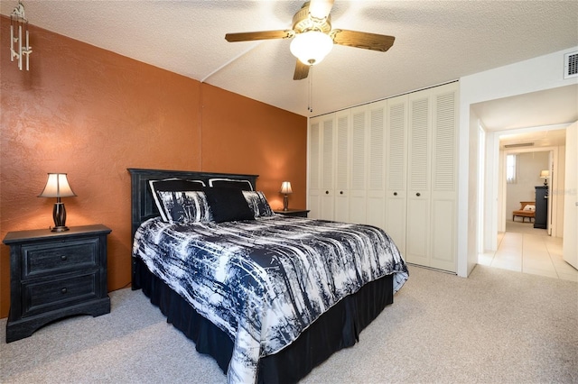 325 Wilder Blvd Unit A102, Daytona Beach, FL 32114 - carpeted bedroom featuring ceiling fan, a closet, and a textured ceiling