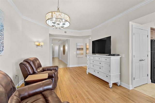 2901 S Atlantic Ave Unit 401, Daytona Beach Shores, FL 32118 - living area featuring a chandelier, baseboards, crown molding, and light wood finished floors