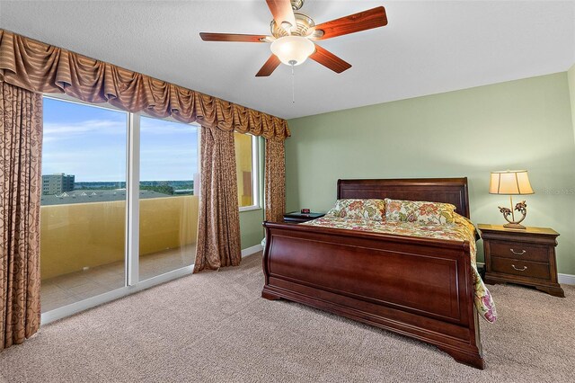 2901 S Atlantic Ave Unit 401, Daytona Beach Shores, FL 32118 - carpeted bedroom featuring baseboards and a ceiling fan