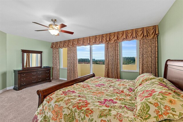 2901 S Atlantic Ave Unit 401, Daytona Beach Shores, FL 32118 - bedroom featuring carpet floors, a ceiling fan, and baseboards