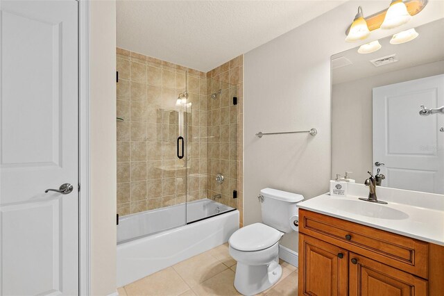 2901 S Atlantic Ave Unit 401, Daytona Beach Shores, FL 32118 - full bath featuring tile patterned floors, vanity, toilet, shower / bath combination with glass door, and baseboards