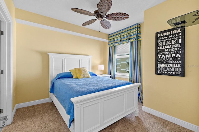 2901 S Atlantic Ave Unit 401, Daytona Beach Shores, FL 32118 - bedroom featuring light colored carpet, baseboards, and ceiling fan