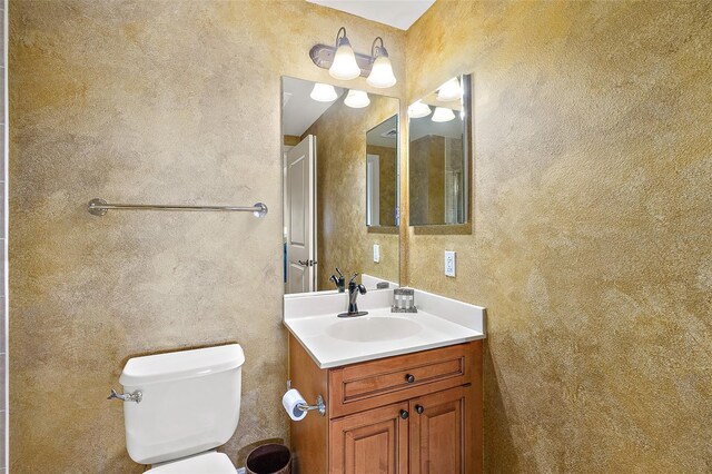 2901 S Atlantic Ave Unit 401, Daytona Beach Shores, FL 32118 - bathroom featuring toilet and vanity