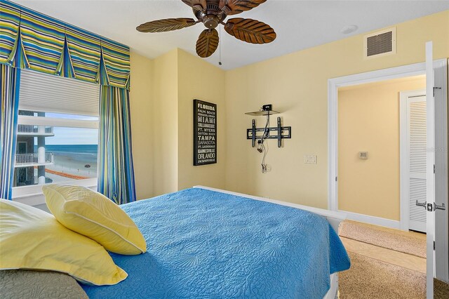 2901 S Atlantic Ave Unit 401, Daytona Beach Shores, FL 32118 - bedroom featuring carpet, ceiling fan, and baseboards