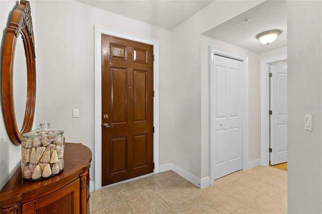2901 S Atlantic Ave Unit 401, Daytona Beach Shores, FL 32118 - entryway featuring light tile patterned floors and baseboards