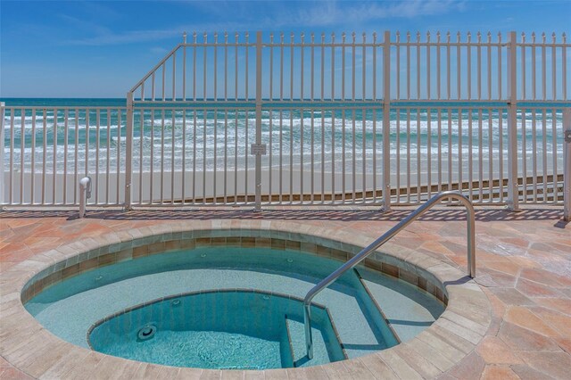 2901 S Atlantic Ave Unit 401, Daytona Beach Shores, FL 32118 - view of swimming pool with a hot tub and view of water and beach