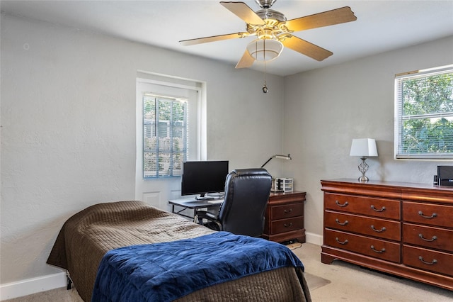 1284 Vanderbilt Dr, Ormond Beach, FL 32174 - bedroom with multiple windows, light carpet, and baseboards