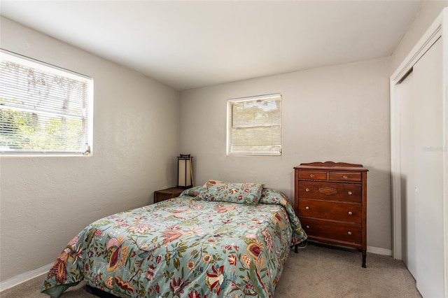 1284 Vanderbilt Dr, Ormond Beach, FL 32174 - carpeted bedroom with multiple windows and baseboards