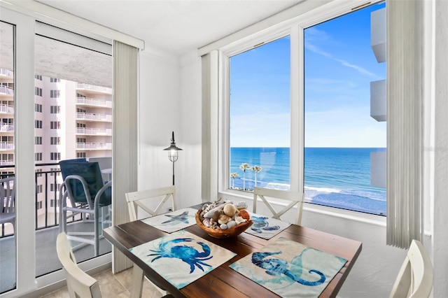 2987 S Atlantic Unit 606, Daytona Beach Shores, FL 32118 - dining area featuring plenty of natural light and a water view
