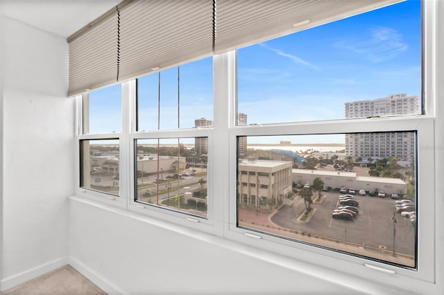 2987 S Atlantic Unit 606, Daytona Beach Shores, FL 32118 - sunroom featuring a city view