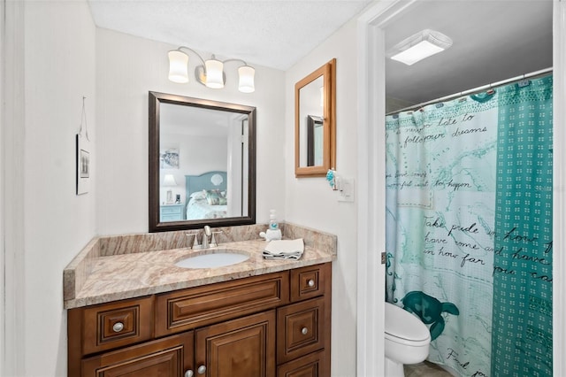 2987 S Atlantic Unit 606, Daytona Beach Shores, FL 32118 - bathroom featuring toilet, vanity, and a shower with curtain
