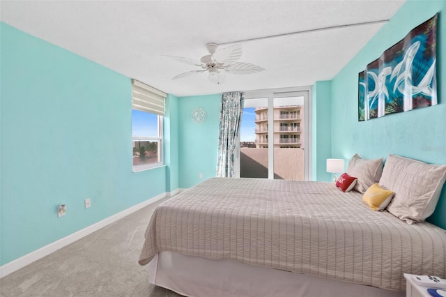 2987 S Atlantic Unit 606, Daytona Beach Shores, FL 32118 - carpeted bedroom with a ceiling fan and baseboards