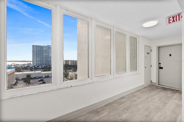 2987 S Atlantic Unit 606, Daytona Beach Shores, FL 32118 - unfurnished sunroom with a view of city