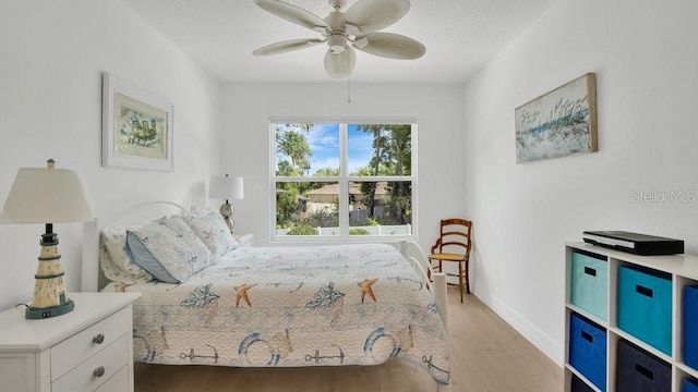 302 Tammie Sue Ln, Deland, FL 32724 - bedroom with light wood-type flooring, baseboards, and a ceiling fan