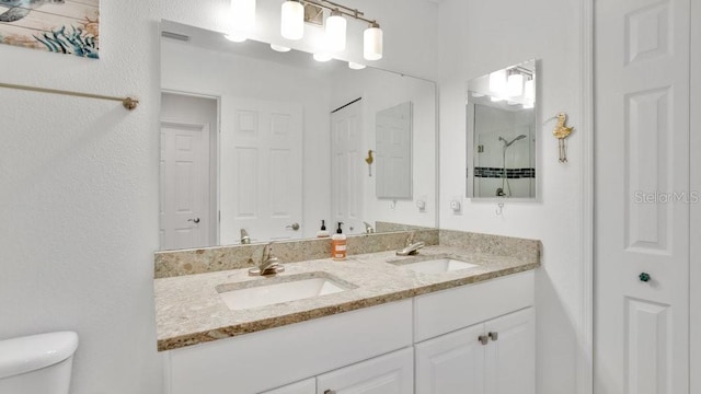 302 Tammie Sue Ln, Deland, FL 32724 - bathroom with double vanity, a closet, toilet, and a shower
