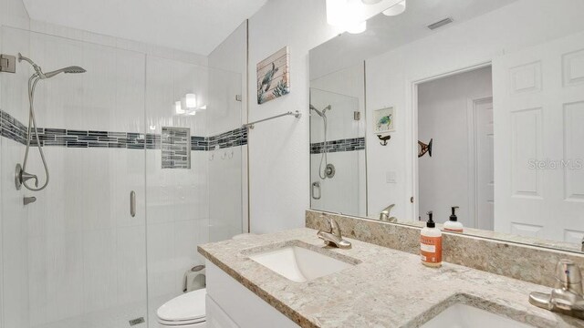 302 Tammie Sue Ln, Deland, FL 32724 - full bath with a shower stall, double vanity, and toilet