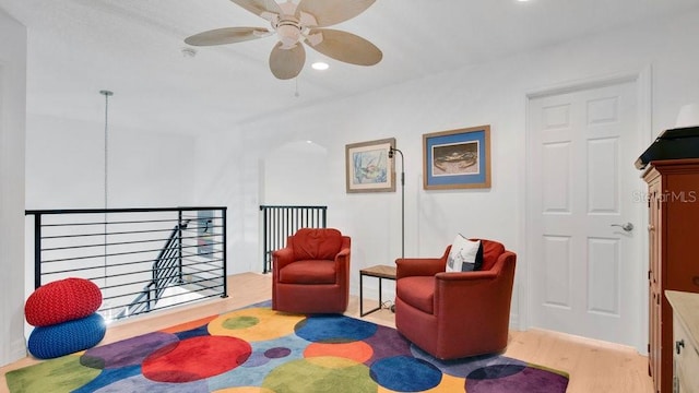 302 Tammie Sue Ln, Deland, FL 32724 - sitting room featuring a ceiling fan, wood finished floors, an upstairs landing, and recessed lighting