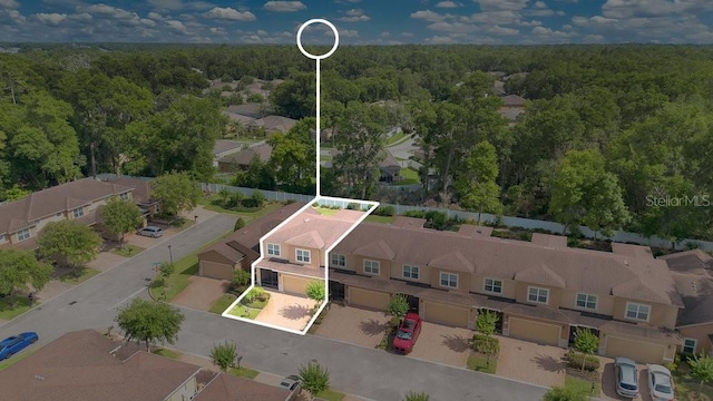 302 Tammie Sue Ln, Deland, FL 32724 - aerial view of residential area featuring a forest and property parcel outlined