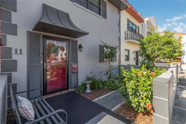 625 N Halifax Ave Unit 11, Daytona Beach, FL 32118 - entrance to property featuring stucco siding and a balcony