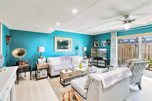 625 N Halifax Ave Unit 11, Daytona Beach, FL 32118 - living room featuring a textured ceiling, recessed lighting, ceiling fan, and wood finished floors