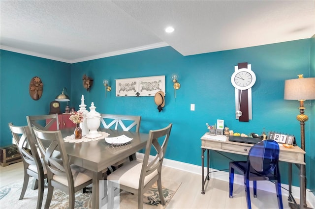 625 N Halifax Ave Unit 11, Daytona Beach, FL 32118 - dining room with a textured ceiling, ornamental molding, wood finished floors, recessed lighting, and baseboards