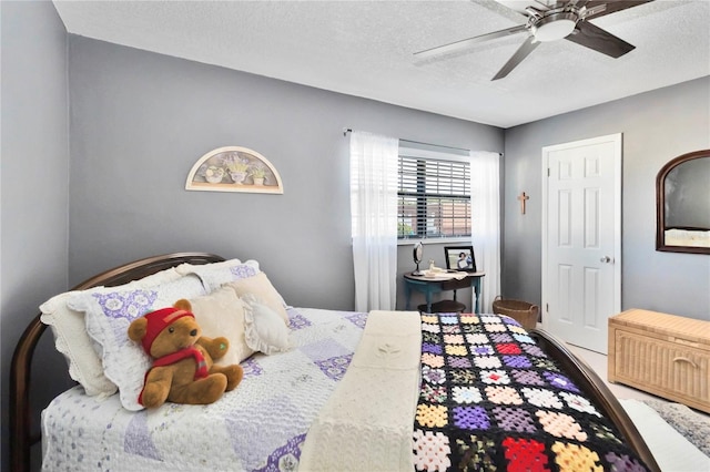 625 N Halifax Ave Unit 11, Daytona Beach, FL 32118 - bedroom featuring a textured ceiling and ceiling fan