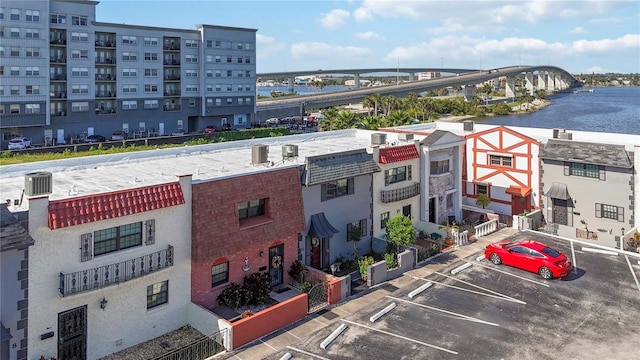625 N Halifax Ave Unit 11, Daytona Beach, FL 32118 - view of apartment building / complex with uncovered parking, a water view, and cooling unit