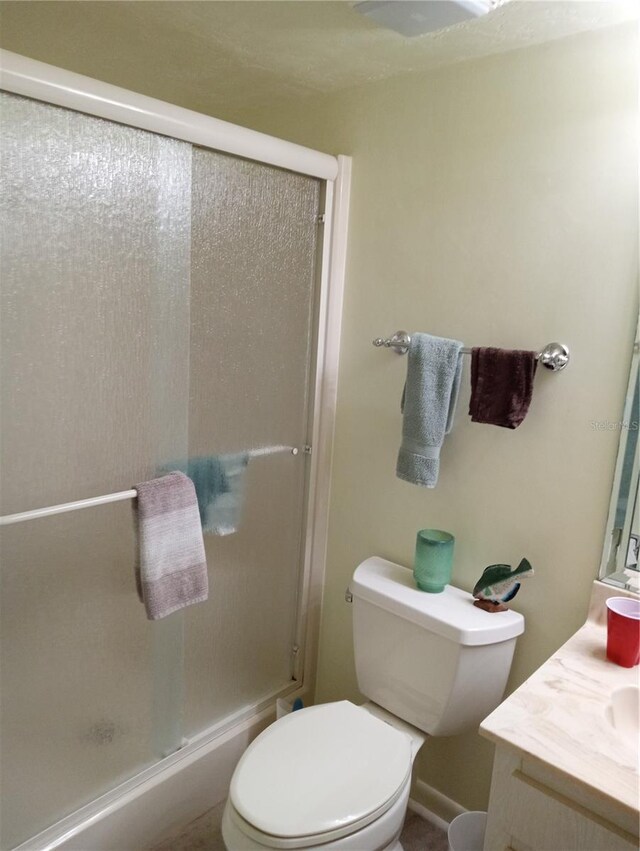 1640 Juno Trl Unit 103F, Astor, FL 32102 - full bath with vanity, a shower stall, and toilet