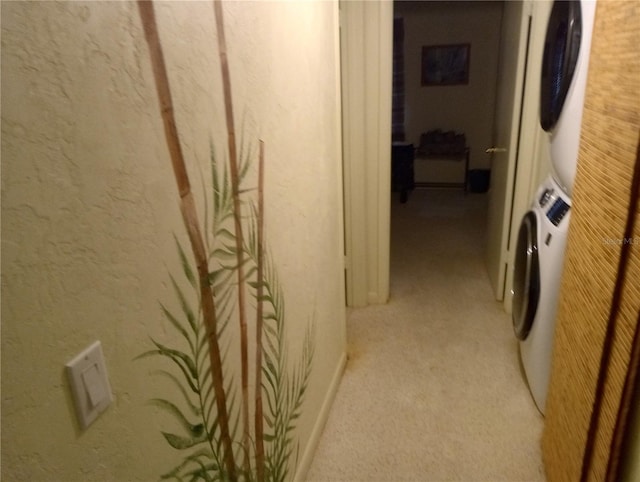1640 Juno Trl Unit 103F, Astor, FL 32102 - hall featuring stacked washer and clothes dryer and light carpet