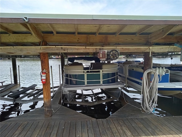 1640 Juno Trl Unit 103F, Astor, FL 32102 - dock area with boat lift and a water view