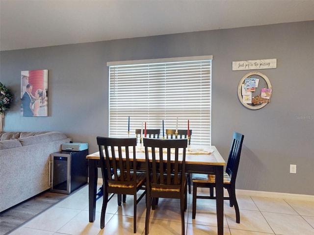 2919 Sime St, New Smyrna Beach, FL 32168 - dining space featuring light tile patterned floors and baseboards