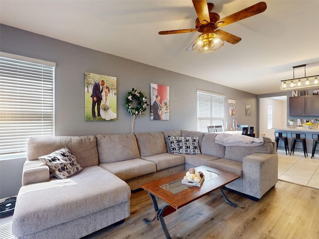 2919 Sime St, New Smyrna Beach, FL 32168 - living area featuring light wood-style flooring and ceiling fan