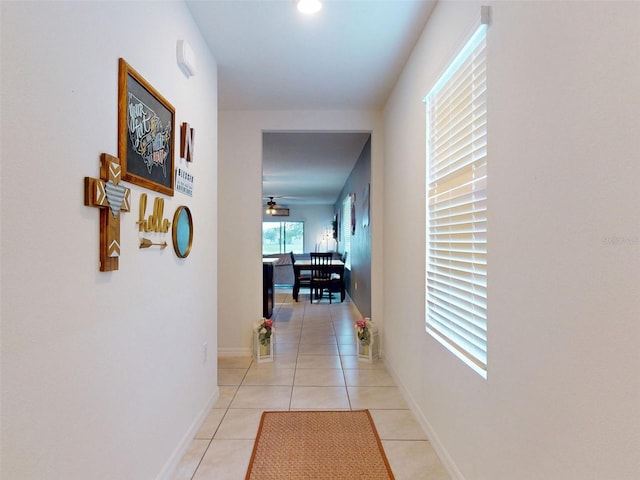 2919 Sime St, New Smyrna Beach, FL 32168 - corridor featuring light tile patterned flooring and baseboards