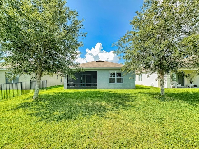 2919 Sime St, New Smyrna Beach, FL 32168 - rear view of property featuring stucco siding and a sunroom