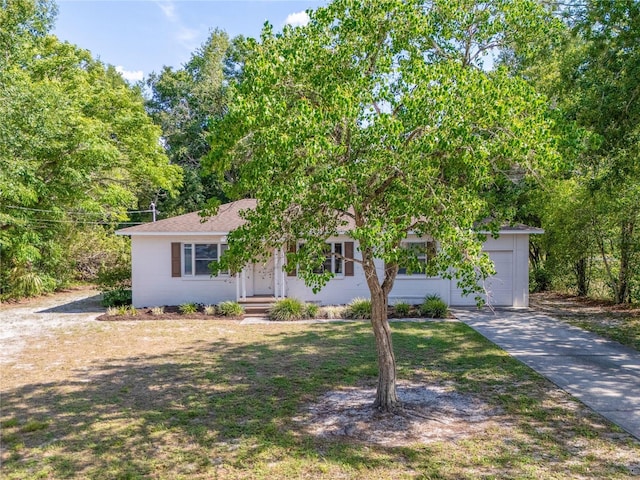 31 Lake Dr, Debary, FL 32713 - view of front of house with driveway and an attached garage