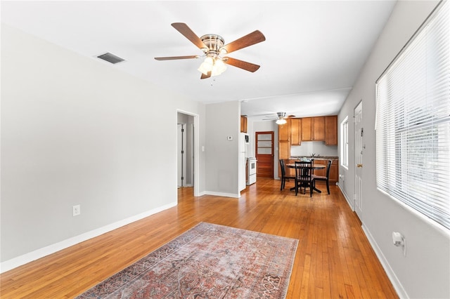 31 Lake Dr, Debary, FL 32713 - living area featuring a ceiling fan, light wood-type flooring, and baseboards