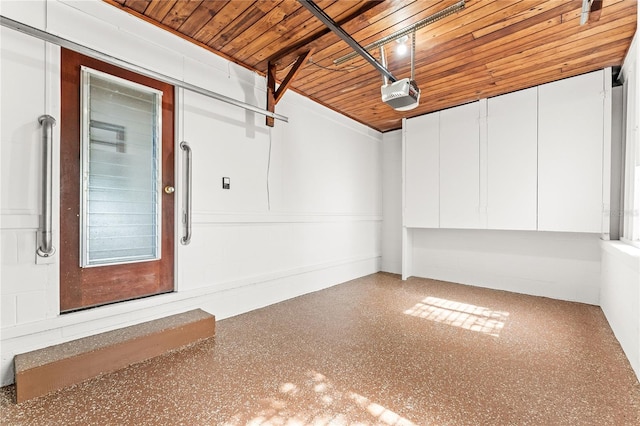 31 Lake Dr, Debary, FL 32713 - garage featuring a garage door opener and wooden ceiling